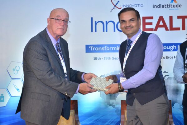 Dr Ronald Heslegrave presenting a memento to Dr V K Sharma at InnoHEALTH 2017 Dr Ronald Heslegrave presenting a memento to Dr V K Sharma at InnoHEALTH 2017