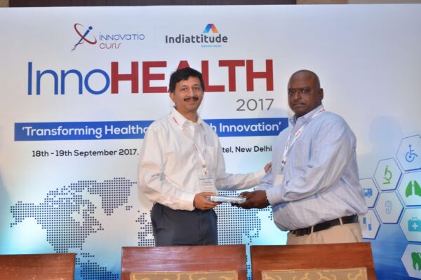 Sandipan Gangopadhyay presenting a memento to Reggie George at InnoHEALTH 2017 Sandipan Gangopadhyay presenting a memento to Reggie George at InnoHEALTH 2017