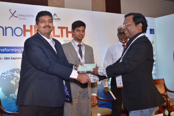 Eur Ing Muthu Singaram presenting memento to Biten Kathrani at InnoHEALTH 2017 Eur Ing Muthu Singaram presenting memento to Biten Kathrani at InnoHEALTH 2017