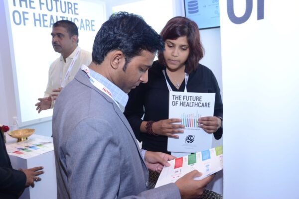 Anusha from GalaXe healthcare solutions briefing an attendee at InnoHEALTH 2017 Anusha from GalaXe healthcare solutions briefing an attendee at InnoHEALTH 2017