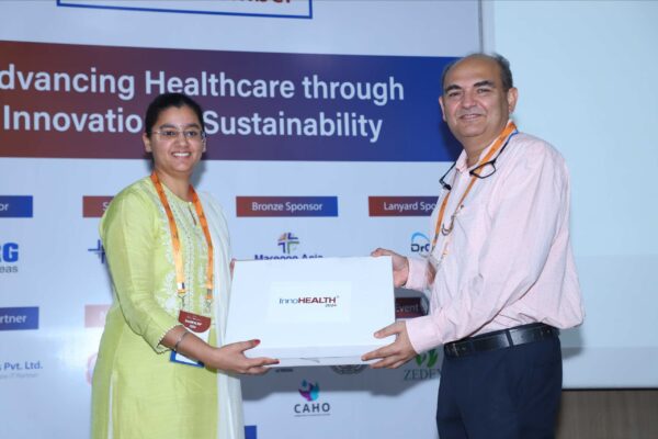 24. Dr. Jaspreet Kaur Dhanjal presenting a memento of appreciation to Brig Dr. Rakesh Dutta at InnoHEALTH 2024 Dr. Jaspreet Kaur Dhanjal presenting a memento of appreciation to Brig Dr. Rakesh Dutta at InnoHEALTH 2024