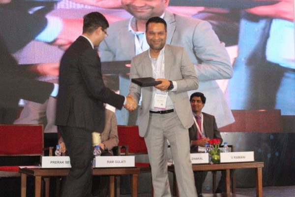 9. Prerak Sethi presents a memento to Bishal Dhakal in session 2 on Achieving universal health coverage, insurance led innovations and AYUSH at InnoHEALTH 2018